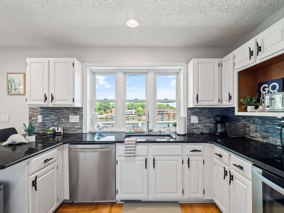 Fully equipped kitchen w/ ample counter space & natural light for easy cooking