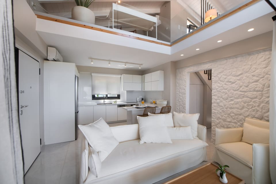Executive Duplex | Living area | 43-inch flat-screen TV with digital channels