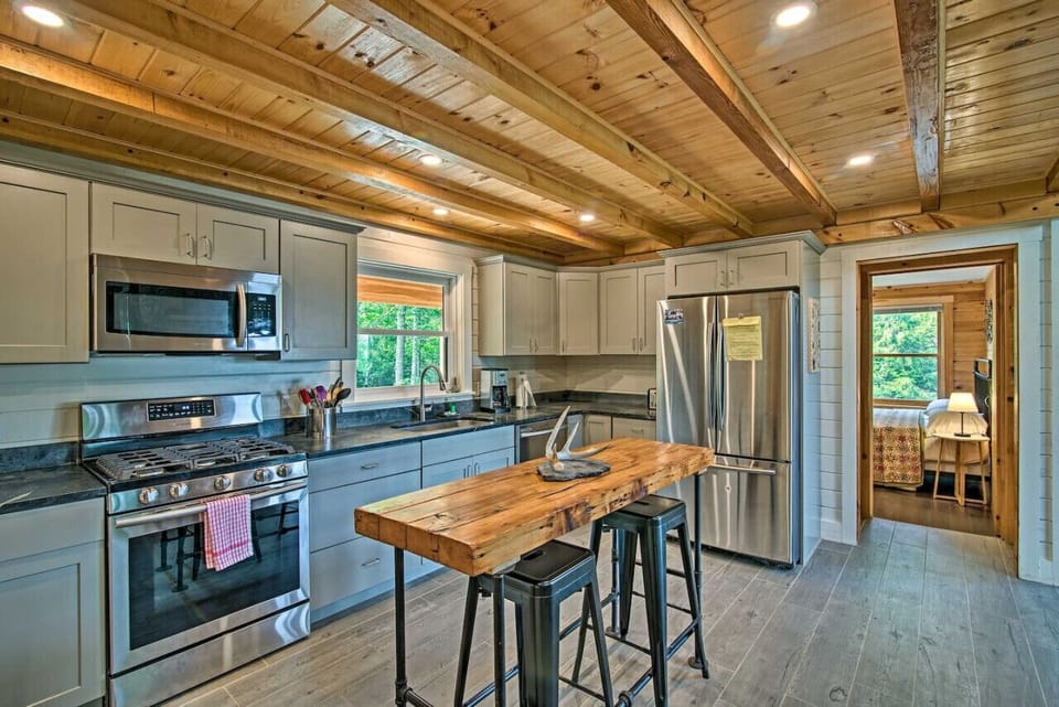 Sleek and Stylish: Where Grey Cupboards and Stainless Appliances Define Modern Elegance