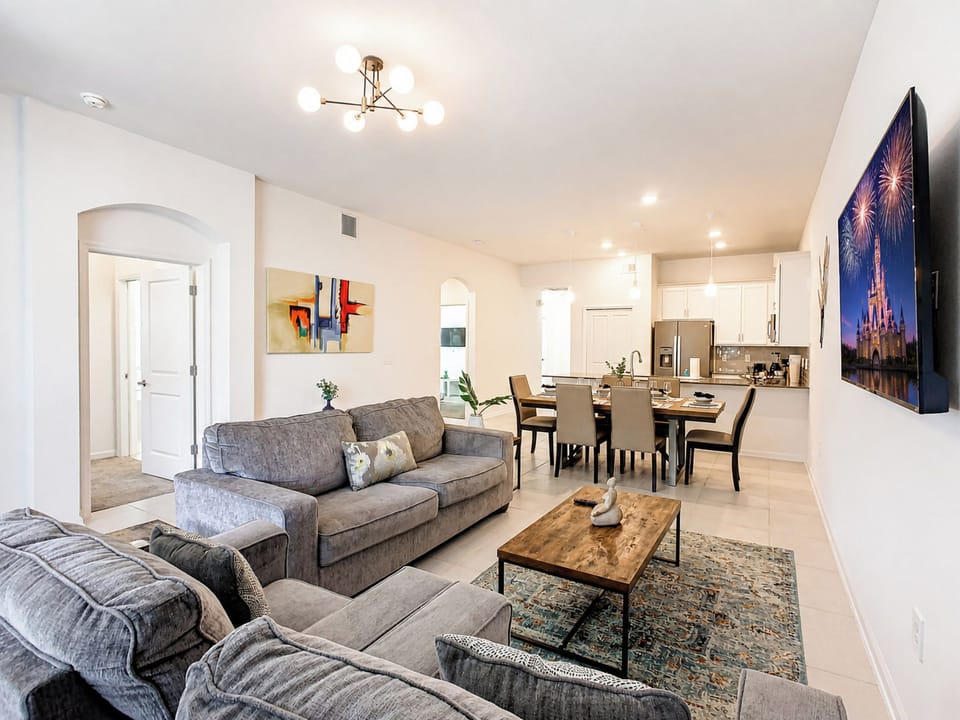 Open-Concept Living Room with Plush Sofas and Dining Area