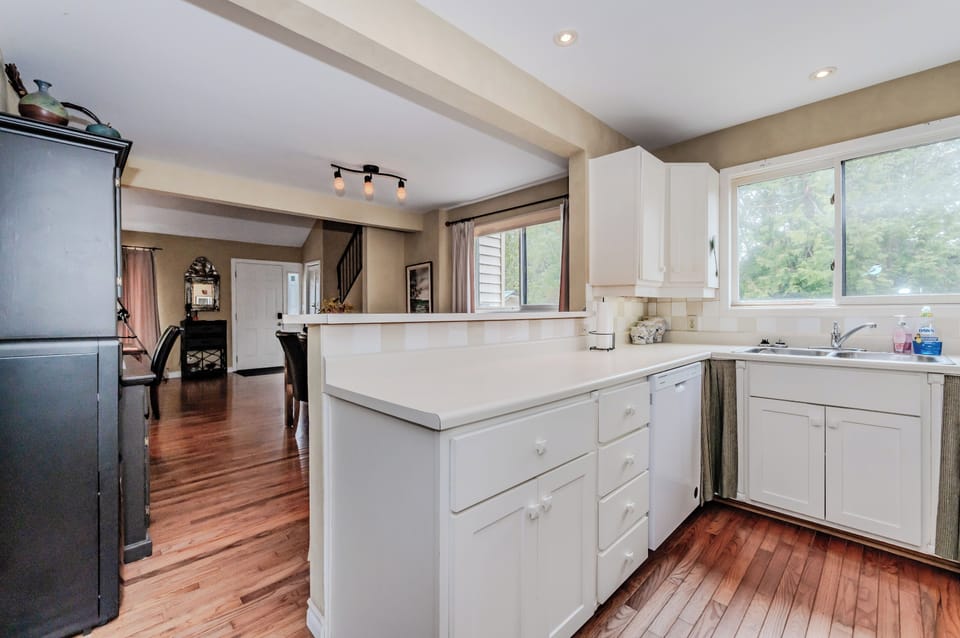 The open-concept kitchen flows seamlessly into the dining and living areas, keeping everyone connected during your stay.