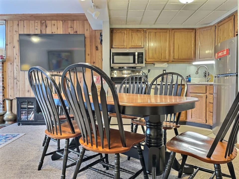 Dining table opens up to the kitchen and living room.