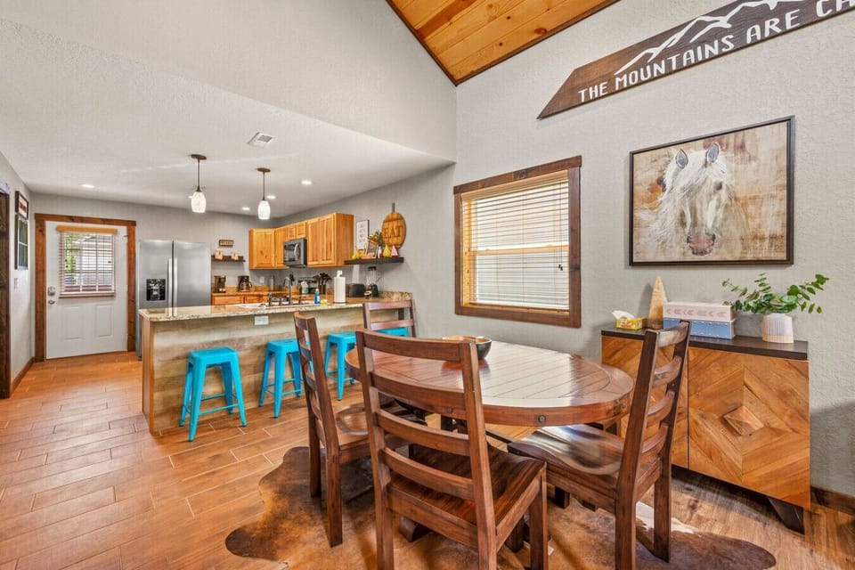 There is a dining table located just off the kitchen as well as bar stools provided for additional seating.