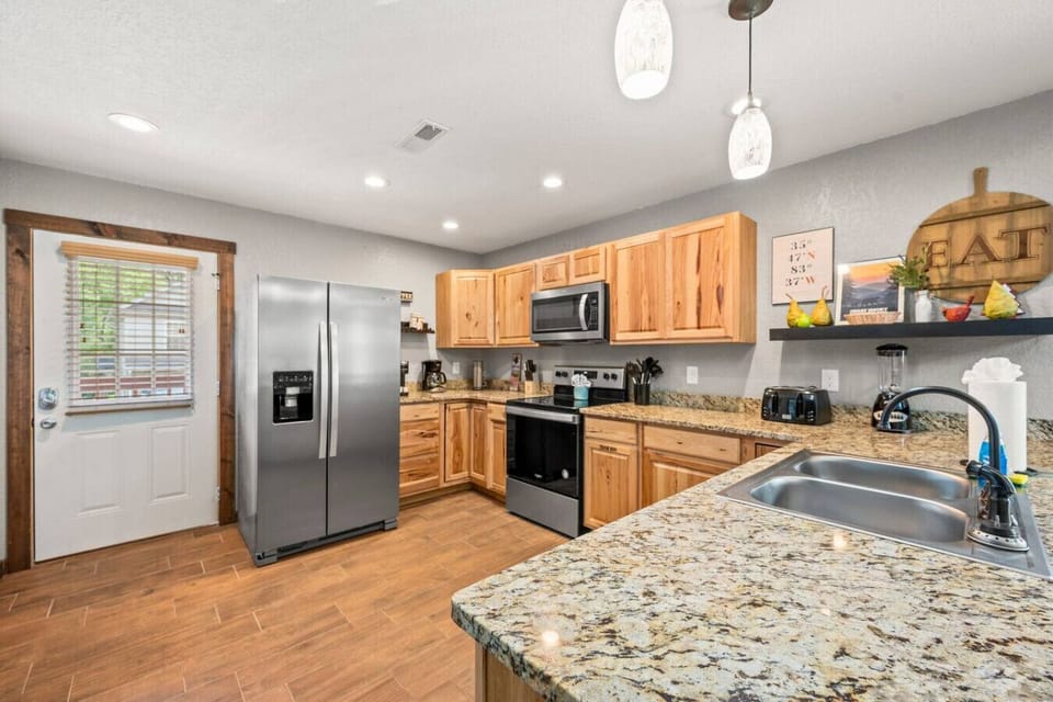 Fully-equipped kitchen with stainless steel appliances.