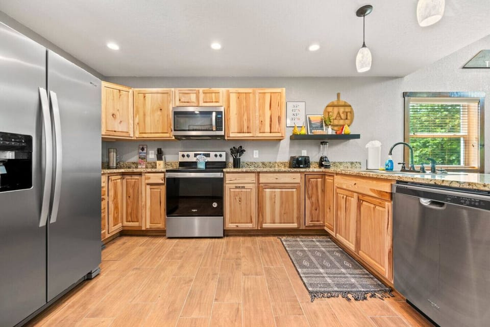 The kitchen is fully stocked and includes a full suite of appliances, cookware, silverware, bakeware, and more.