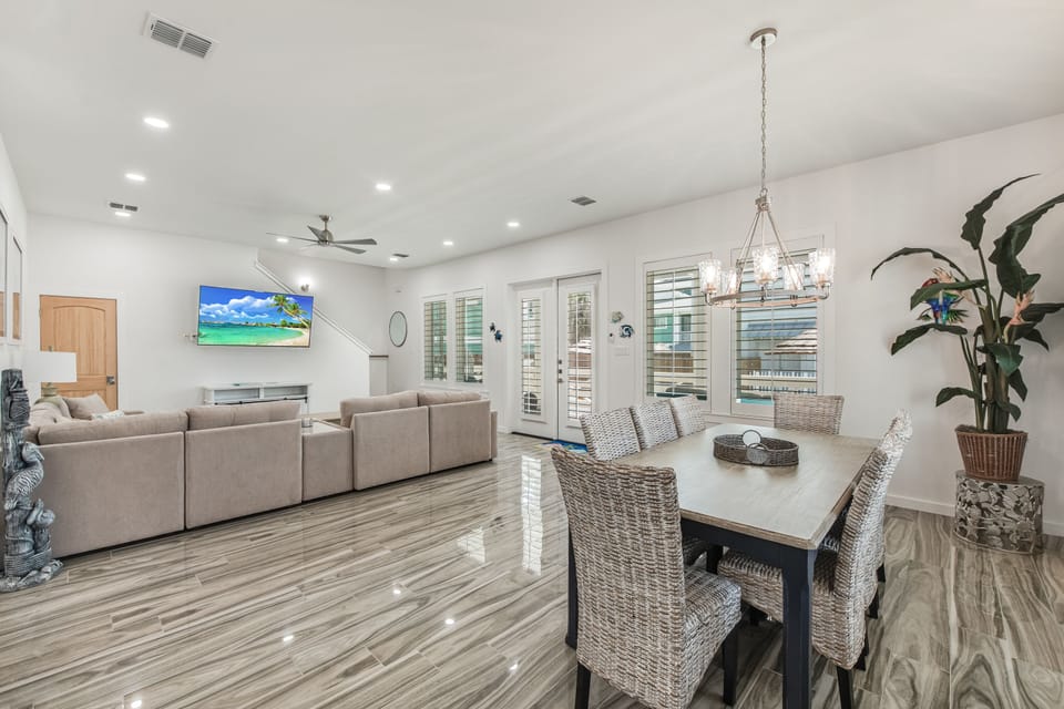 Relax in your spacious open-concept living area with modern furnishings, stylish dining space, and entertainment setup for memorable evenings.