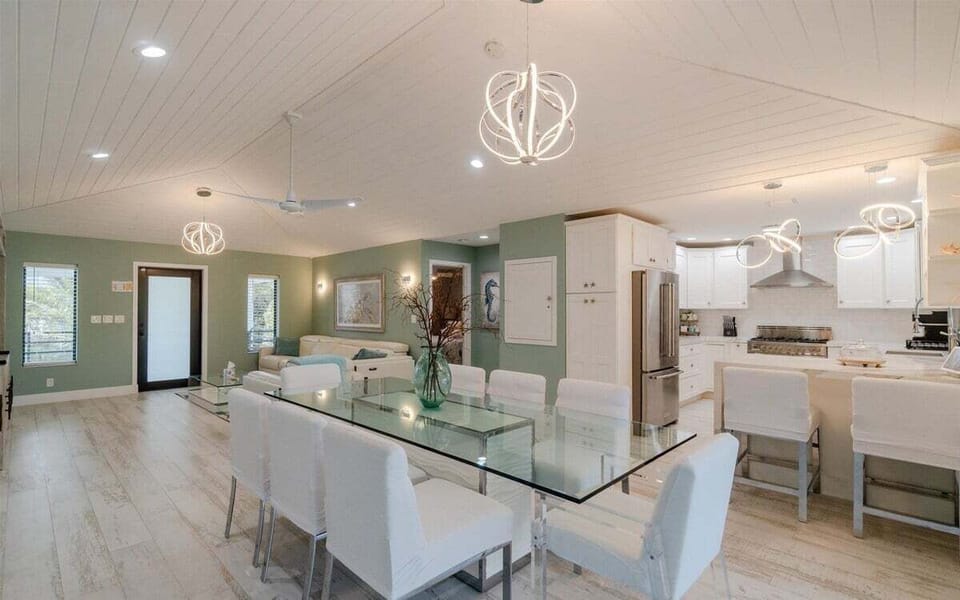 Feast in elegance: Where meals become memories around the sleek glass table, with room for everyone to gather.