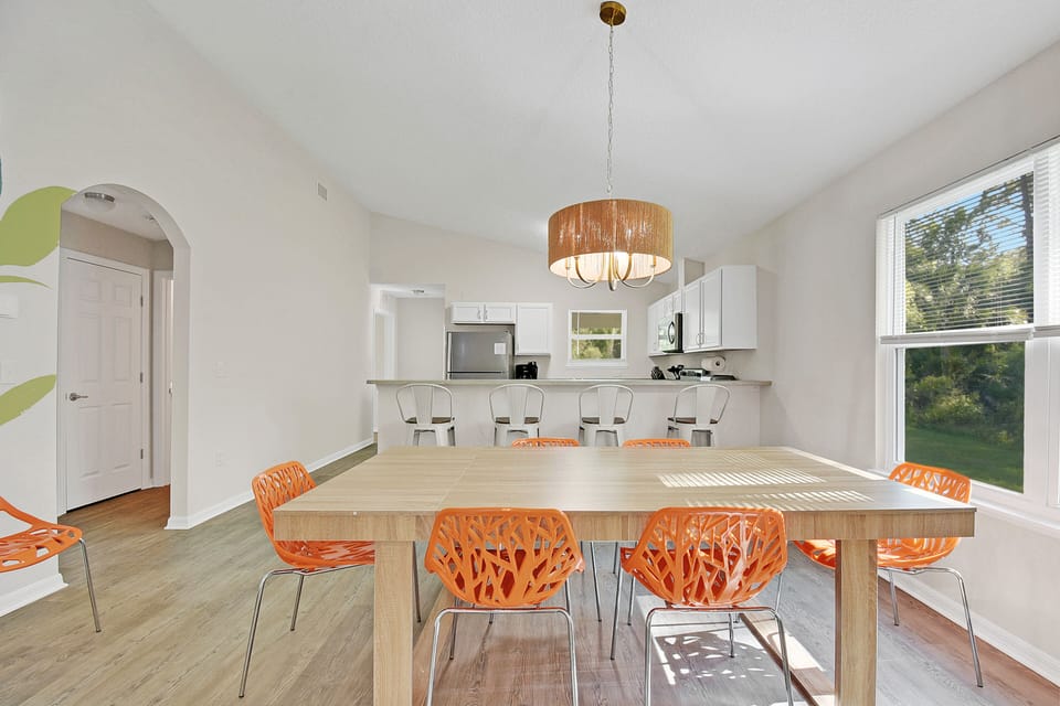 Dinning for 8 at the table and an additional 4 at the counter. + Highchair