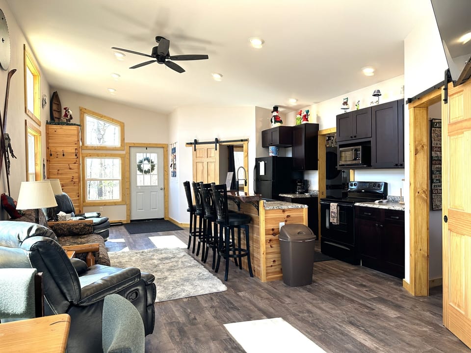 Living Room, Kitchen, and Dining Area showing front door