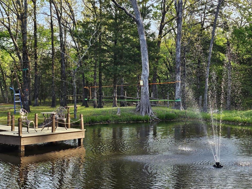 Private stocked pond with fishing deck