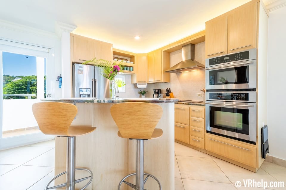 Unit Overview #11: the kitchen area also features an island with bar seating.