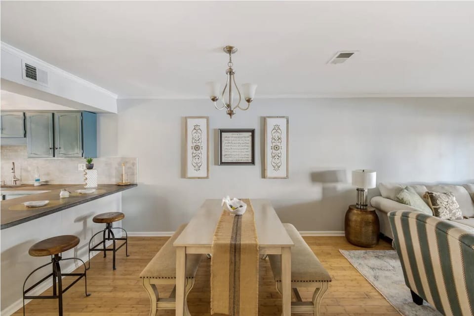 Large dining table easily seats 4-6. There is also a bar with 2 stools.