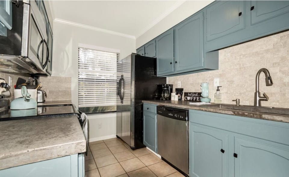 Flat top stove, dishwasher, new large  French door refrigerator/freezer.