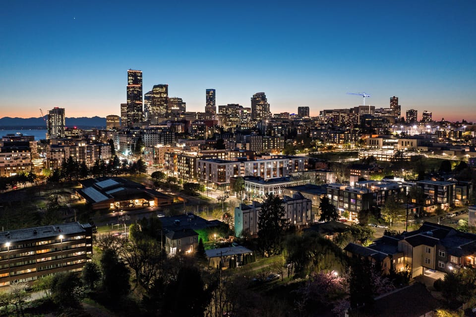 Seattle skyline magic at dusk—just minutes from your stay. 🌆✨