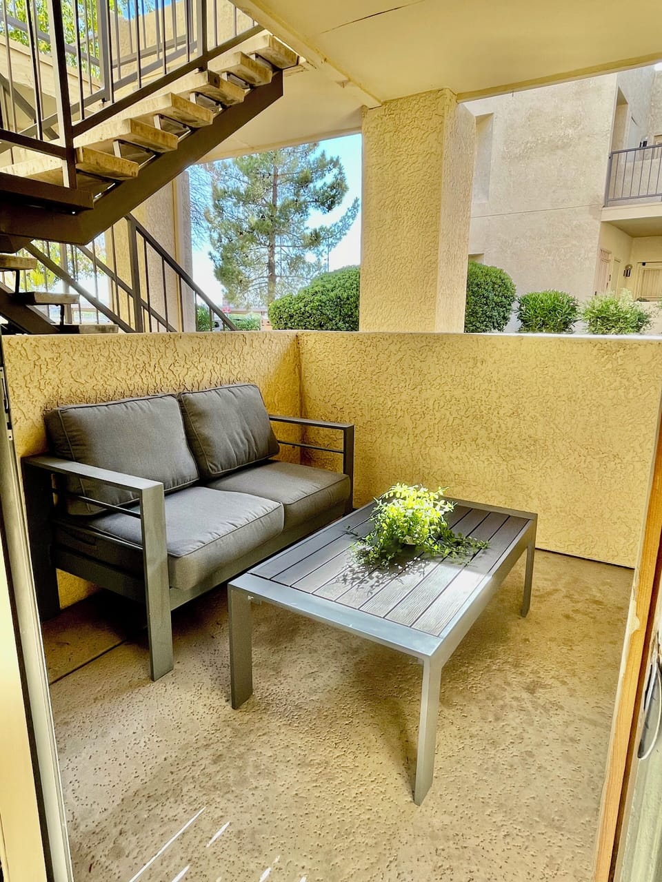 Cute Patio Area with seating area and table. 