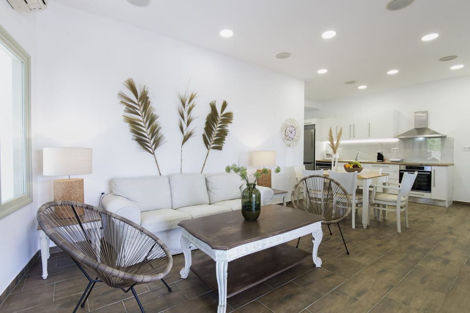 Family Apartment, 3 Bedrooms | Living area | Flat-screen TV