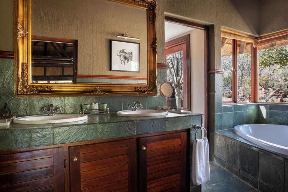 Luxury Suite, 1 King Bed, Non Smoking, River View | Bathroom sink