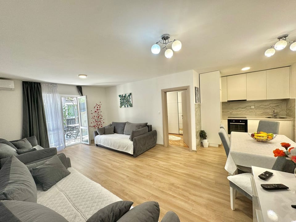 Family Apartment, Garden View | Living area | 32-inch LCD TV with cable channels