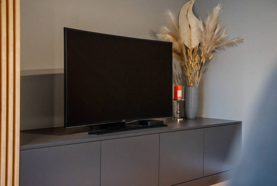 Comfortable Living Room with Sofa Bed and Smart TV | Book Now with RENTUJEMY