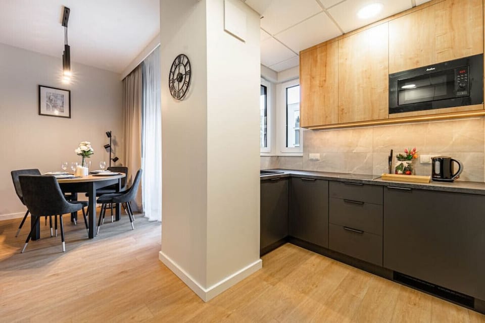 Compact Kitchen with Microwave and Dishwasher | Book Now with RENTUJEMY