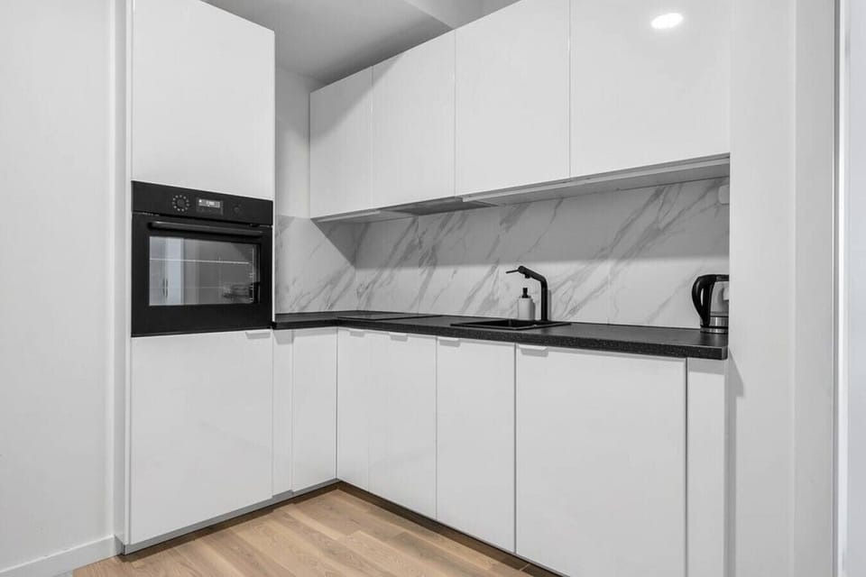 Compact Kitchen with Microwave and other Useful Appliances | Book Now with RENTUJEMY