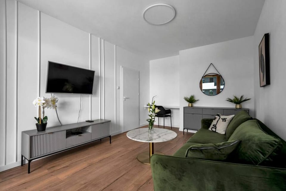 Living Area with Sofa Bed and Big Smart TV | Book Now with RENTUJEMY.COM