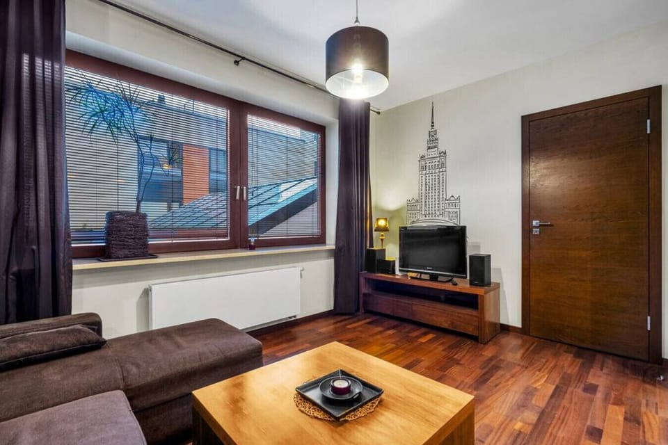 Main Living Area with Sofa Bed and a Smart TV | Book Now with RENTUJEMY.COM