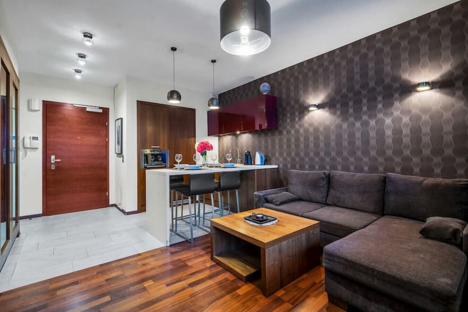 Main Living Area with Sofa Bed and a Smart TV | Book Now with RENTUJEMY.COM