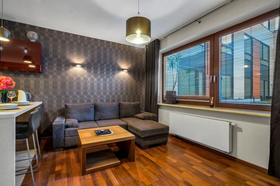 Main Living Area with Sofa Bed and a Smart TV | Book Now with RENTUJEMY.COM