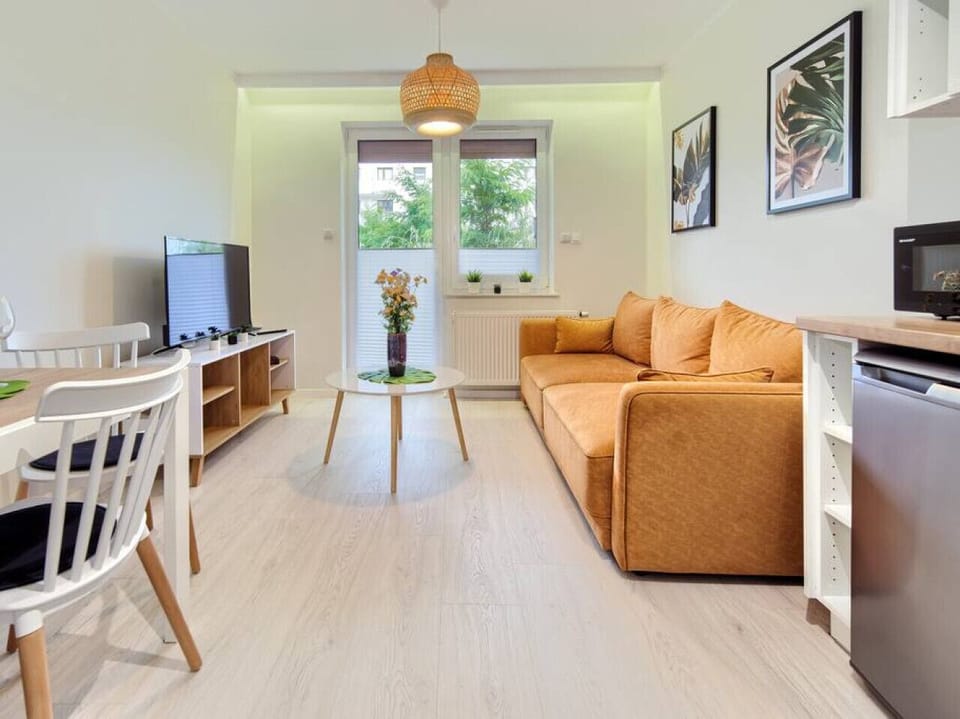 Modern Living Room With Smart TV and Sofa Bed | Book Now With RENTUJEMY