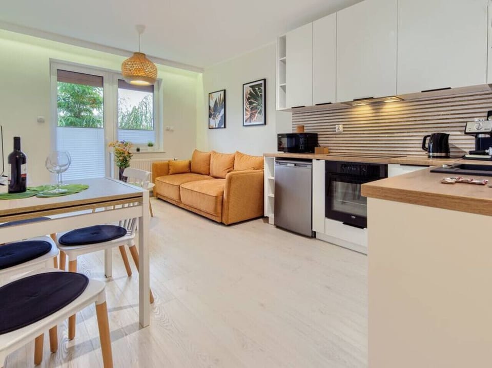 Modern Living Room With Smart TV and Sofa Bed And Fully Equipped Kitchen | Book Now With RENTUJEMY