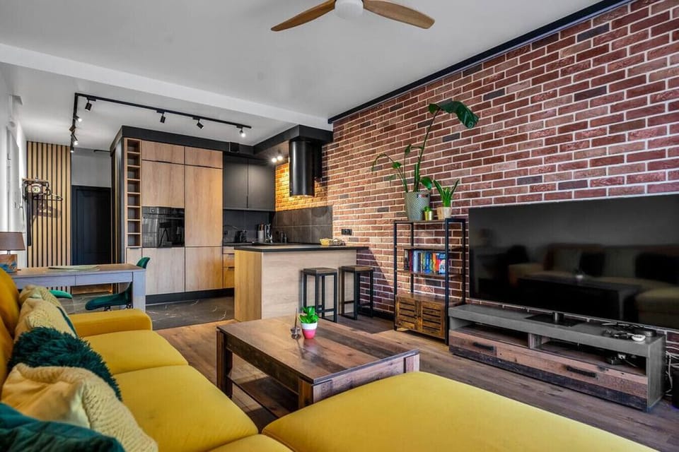 Comfortable Living Room with Sofa Bed and Smart TV | Book Now with RENTUJEMY