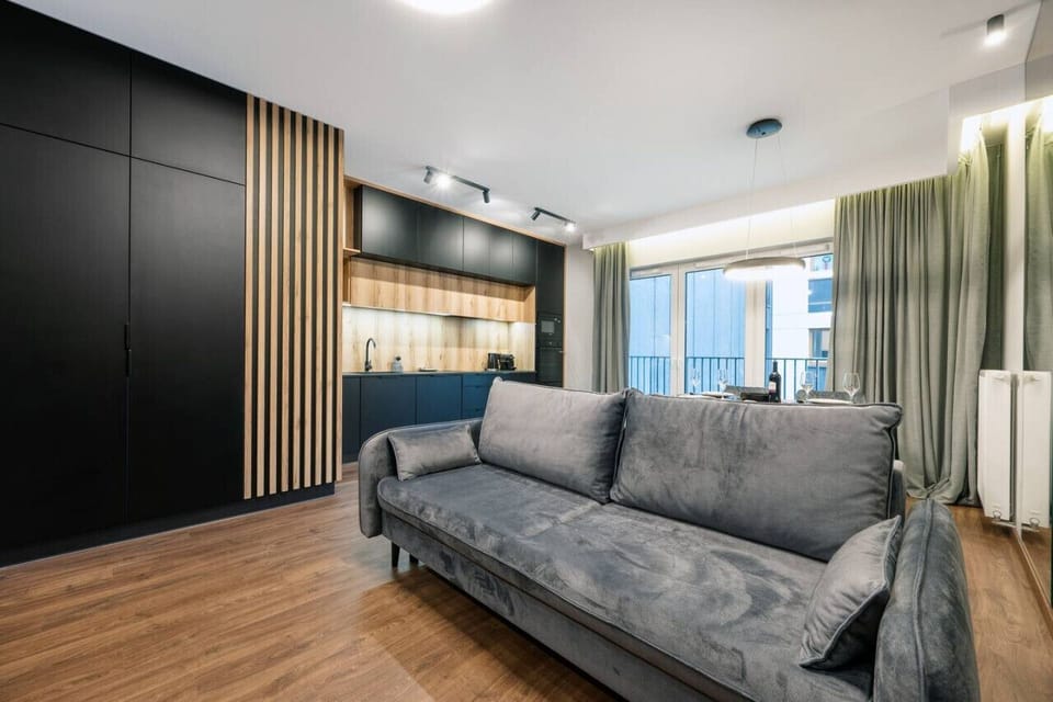 Comfortable Living Room with Sofa Bed and Smart TV | Book Now with RENTUJEMY