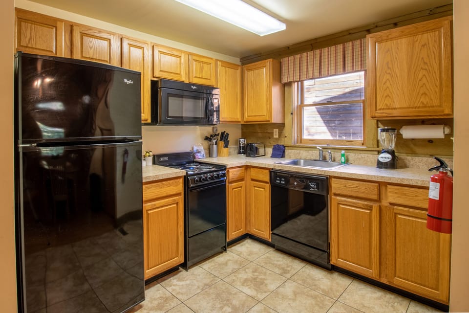 Full kitchen include refrigerator, microwave, stove top and over, dishwasher, coffee maker and more. 