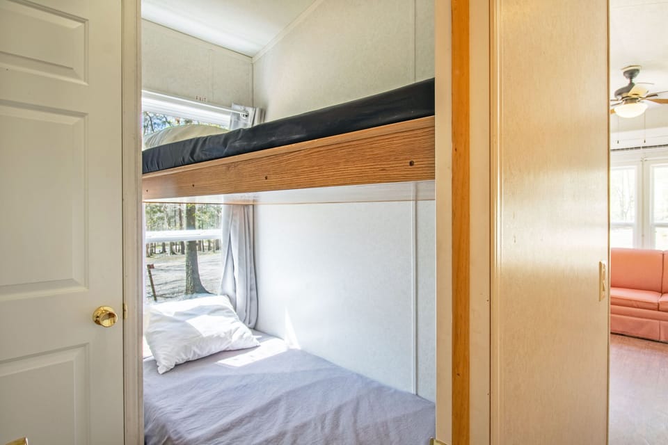 A first bedroom with twin over twin bunk beds