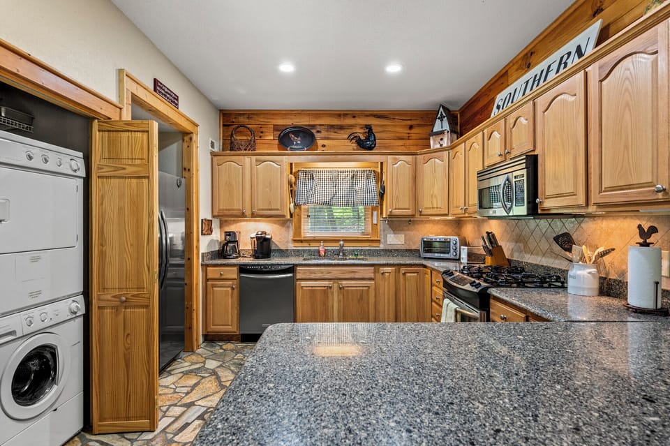 Tons of counter space, stainless steel appliances, washer/dryer.