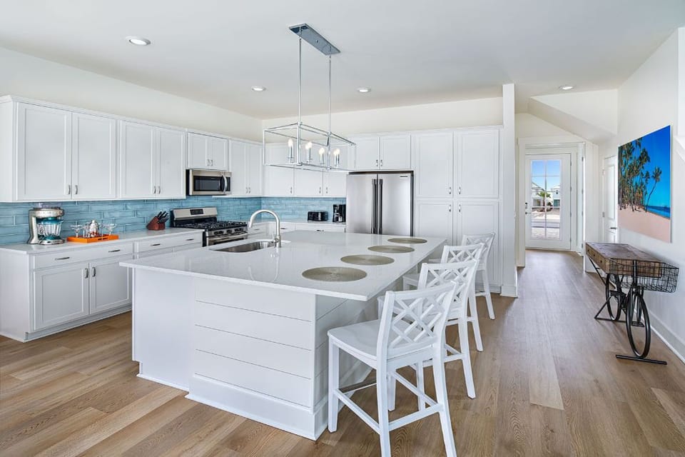 Contemporary kitchen with clean lines and a central island for casual dining experiences.