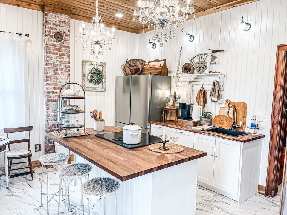 Perfectly curated kitchen with new appliances, and antique decor adds the charm.