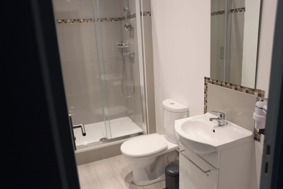Family Room | Bathroom | Hair dryer, towels, soap, toilet paper