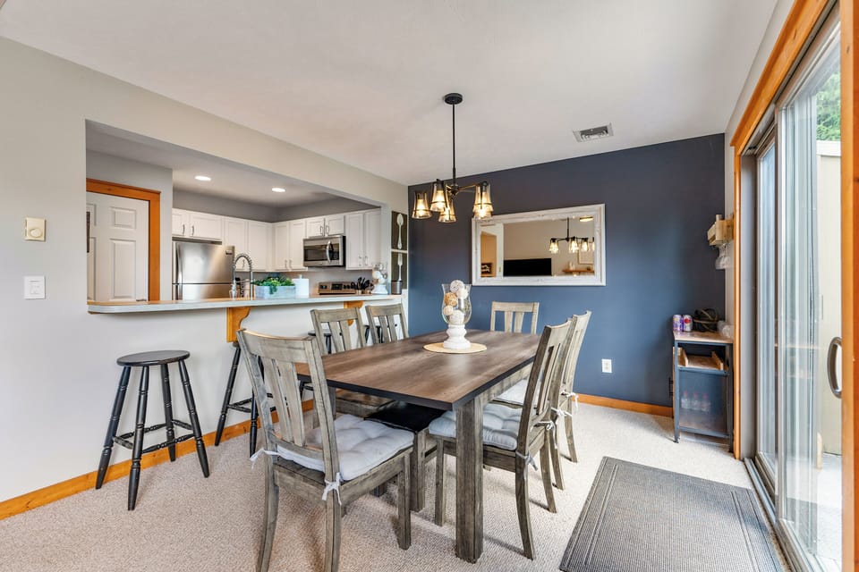 Gather around the inviting table with stunning views and easy kitchen access!