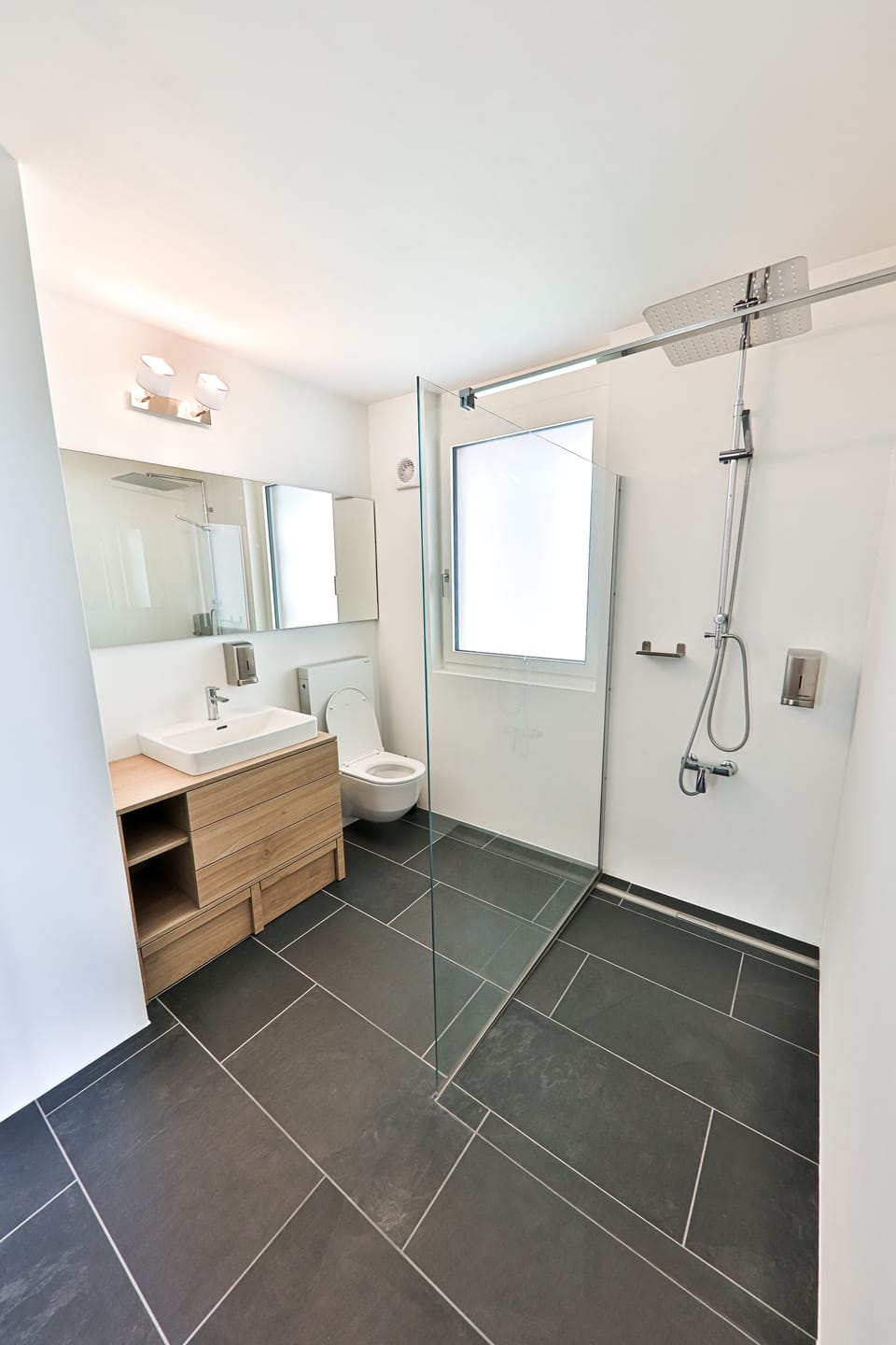 Shower, rainfall showerhead, hair dryer, towels