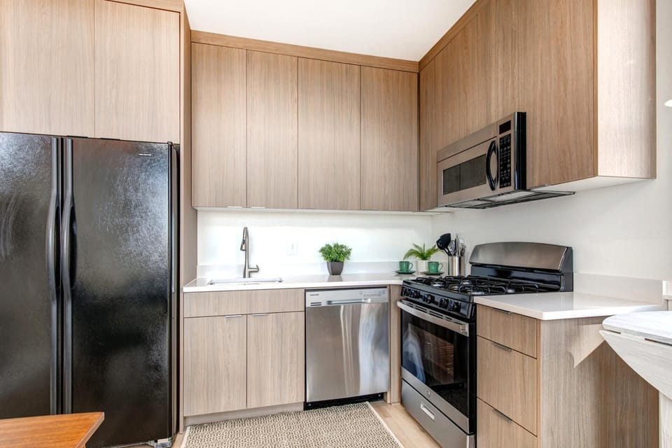A full suite of appliances and sleek design make cooking at home both easy and enjoyable.