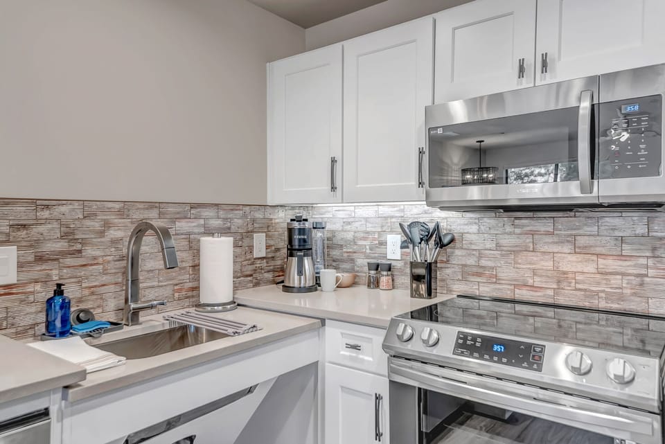 Fully remodeled and equipped kitchen with stainless steel appliances