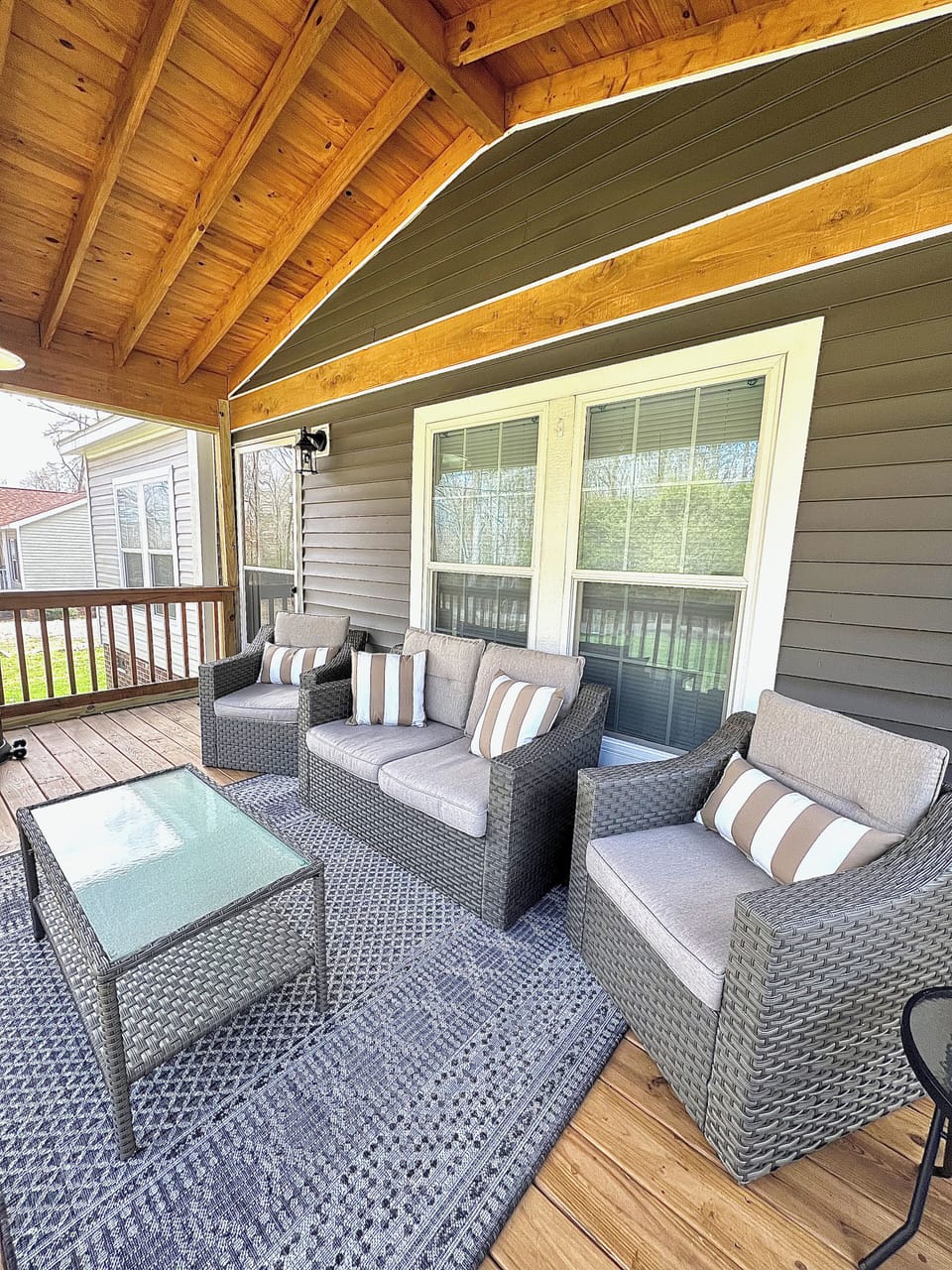 Spacious screened-in front porch with plentiful seating!