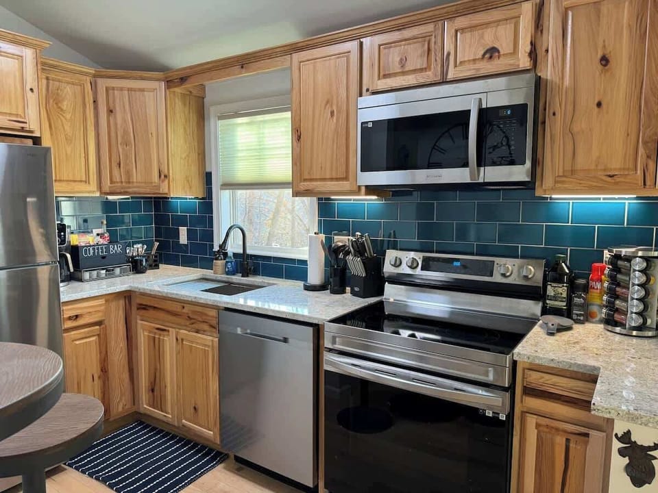 The cabin's kitchen has full size appliances as well as all of the small appliances and culinary features your inner chef desires. 