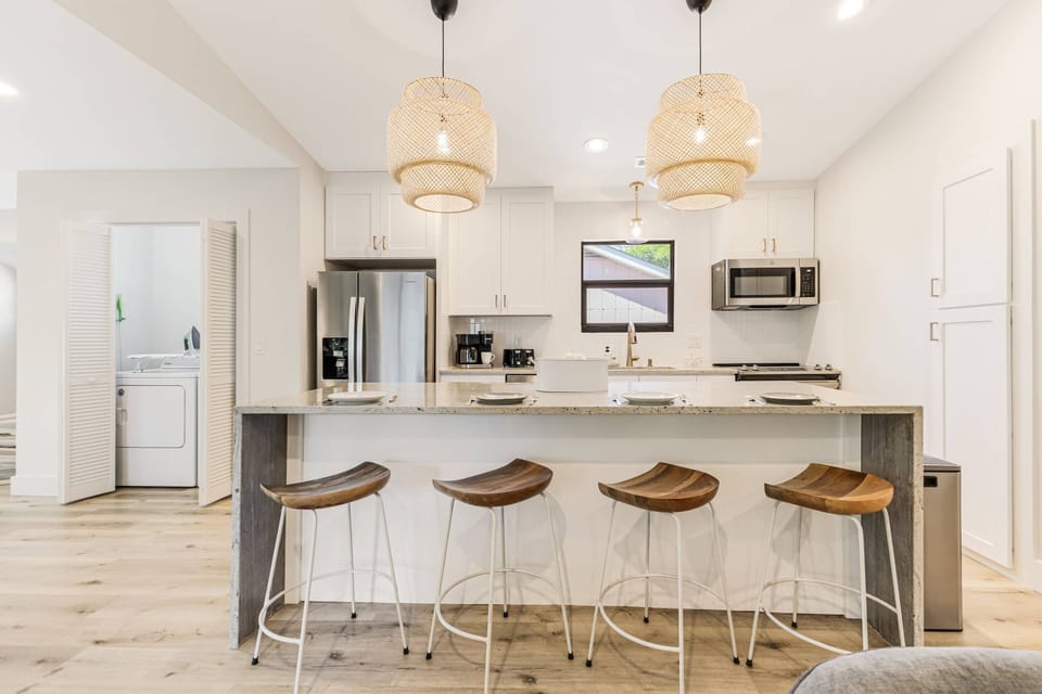 Start your day right! Our kitchen with a breakfast bar offers the perfect spot to enjoy your morning coffee and plan your adventures.