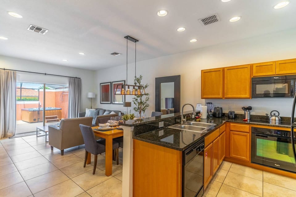 Open kitchen, dining and living areas
