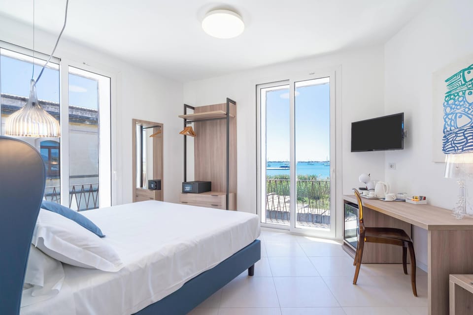 Deluxe Room, Balcony, Sea View | Premium bedding, down comforters, minibar, in-room safe