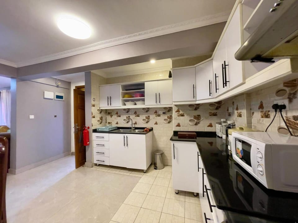 Apartment | Private kitchen | Fridge, microwave, oven, stovetop