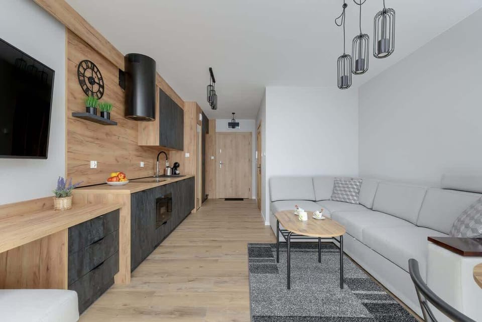 A modern living space with sleek furniture and large windows that let in natural light.